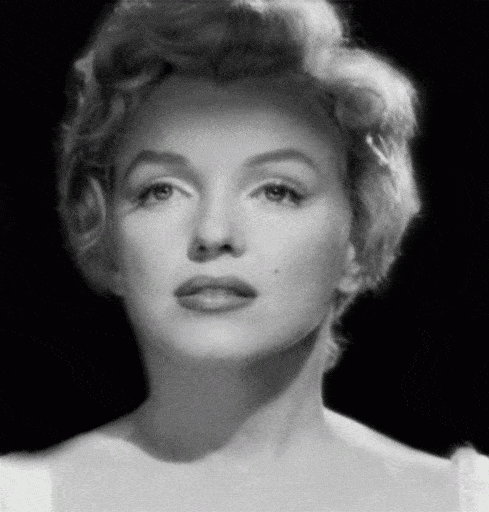 Black-and-white gif of Marilyn Monroe pouting her lips.