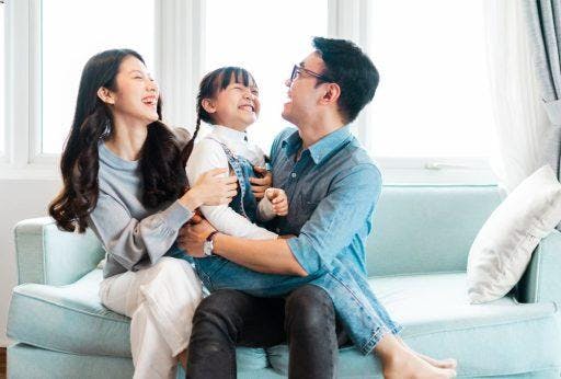 An Asian family enjoying each other’s company at home.