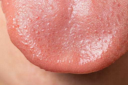Close-up of a human tongue.