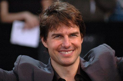 Tom Cruise smiling at an event. 