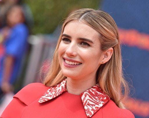 A smiling Emma Roberts in pink.